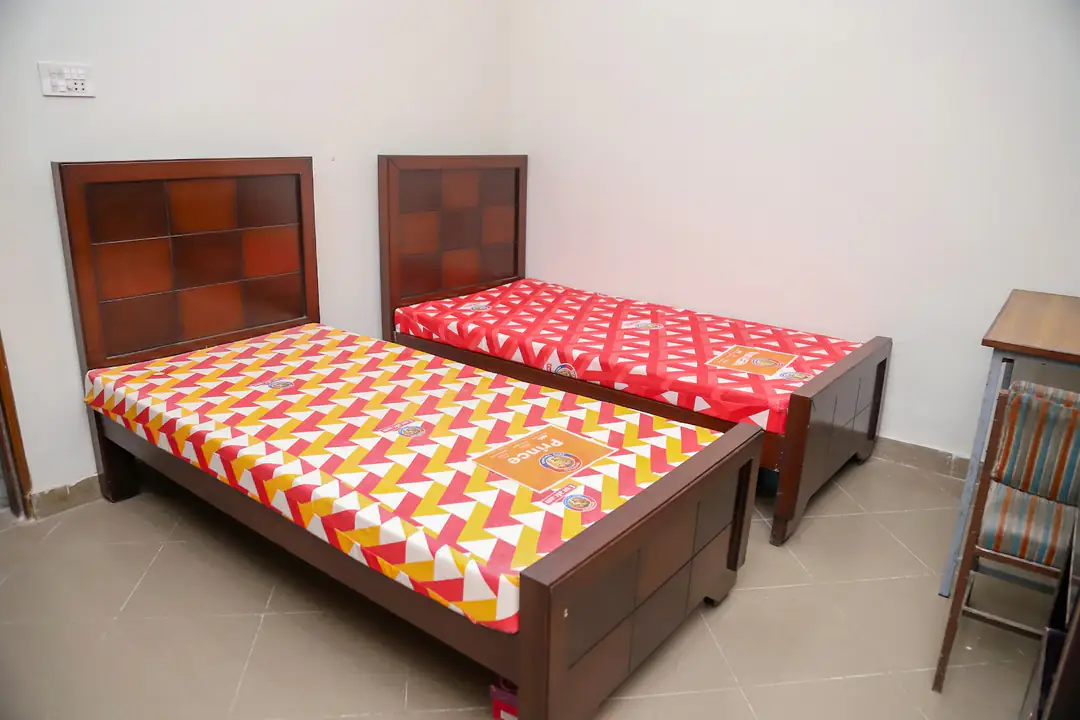Shared bedroom with two beds at Rabia Hall Branch 1
